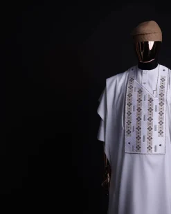 A white, shattered interwoven embroidery with Swarovski stones details agbada