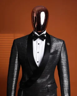 A wire metallic silver and black jacquard, lower cut, wrap shawl lapel tuxedo suit