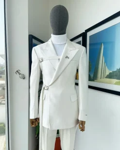 A wrap and strapped ivory white, peak lapel suit