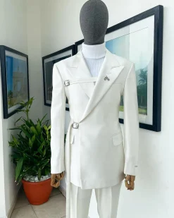 A wrap and strapped ivory white, peak lapel suit