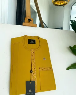 A Yellow, embroidery front flap, and patch pocket detail African traditional senator Kaftan native.