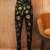 A yellow, silk black jacquard pants with a splash of gold print.