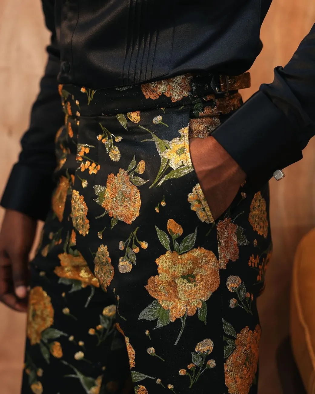 A yellow, silk black jacquard pants with a splash of gold print.