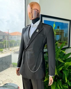 A #Herd” brown leather, knitted & outer layered peak lapel wrap suit