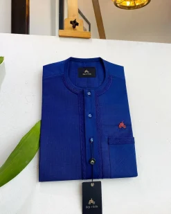An Admiral Blue, clear view blue Swarovski buttons, edge embroidery, pocket details African traditional senator kaftan native.
