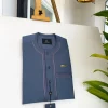 An Air Force blue, clear view Swarovski buttons and embroidery details African traditional senator kaftan native
