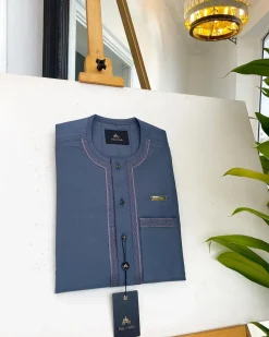 An Air Force blue, clear view Swarovski buttons and embroidery details African traditional senator kaftan native