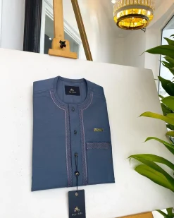 An Air Force blue, clear view Swarovski buttons and embroidery details African traditional senator kaftan native