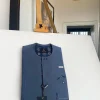 An air-force blue strap and roof pocket, single button front flap Kaftan