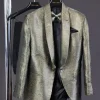 An “alligator” patterned gold metallic jacquard tuxedo suit