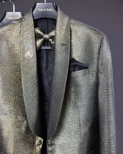 An “alligator” patterned gold metallic jacquard tuxedo suit