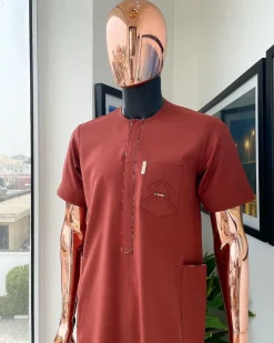 An Amber orange, paisley mountain top patch pocket detailing African traditional senator Kaftan native.
