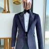 An anchor grey velvet, peak lapel with black silk taping tuxedo suit