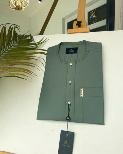 An Aqua green front flap African kaftan with Swarovski button and Sokoto