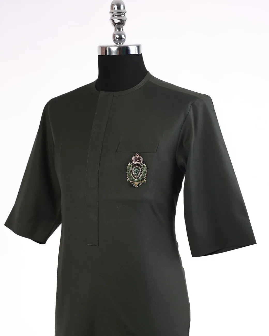 An army green, 3/4 sleeve kaftan, front flap with metal wire embroidery patch detailing african traditional senator kaftan native.