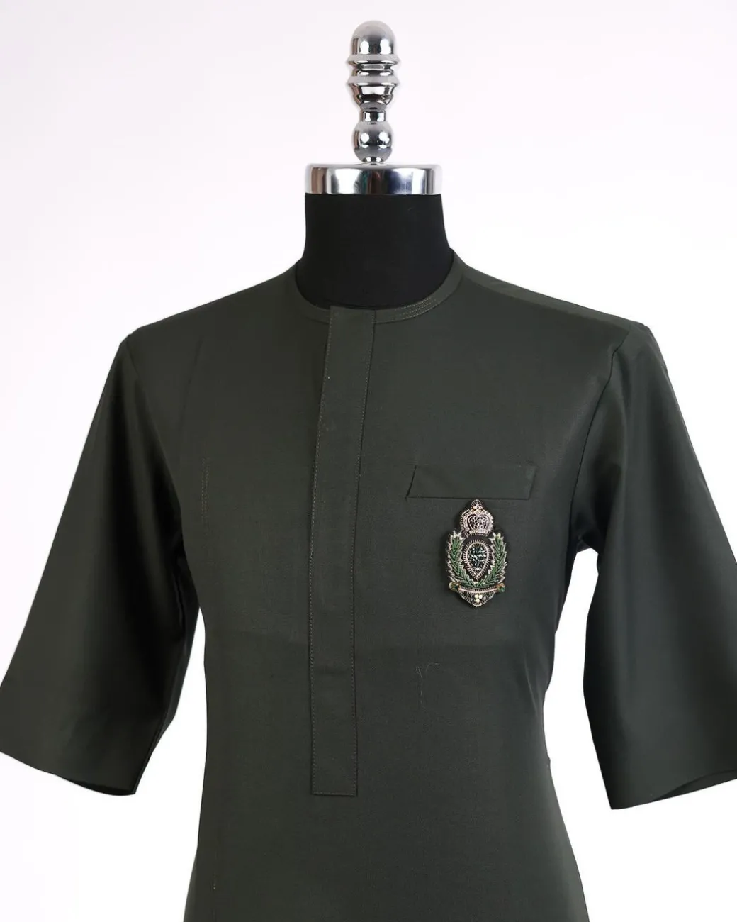 An army green, 3/4 sleeve kaftan, front flap with metal wire embroidery patch detailing african traditional senator kaftan native.