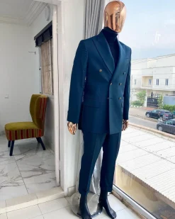An Army green double-breasted peak lapel suit