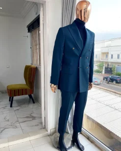 An Army green double-breasted peak lapel suit