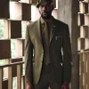 An Army Green Monochrome “Junta” Notch Lapel Suit With Patch Pocket Zip Detailing & Gurkha Pant Trousers.