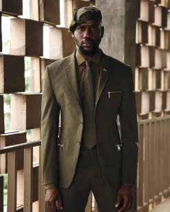 An Army Green Monochrome “Junta” Notch Lapel Suit With Patch Pocket Zip Detailing & Gurkha Pant Trousers.