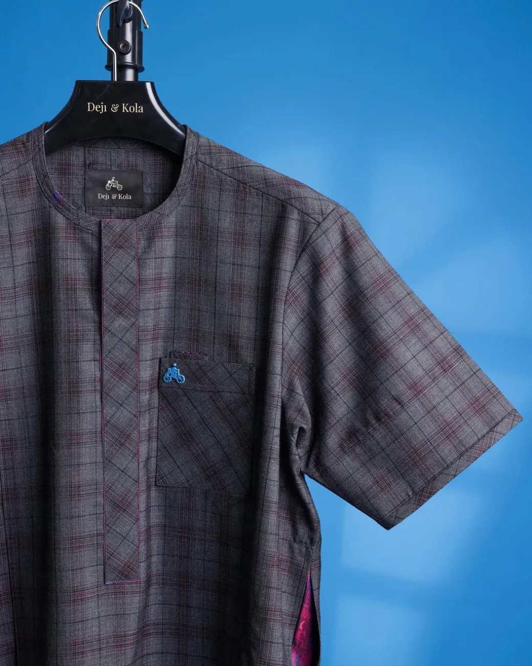 An ash and burgundy jorgecarli check, front flap, short sleeve African senator kaftan native.