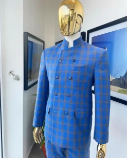 An Azure blue and apricot orange glen check “preacher” double breasted safari suit