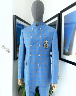 An Azure blue and apricot orange glen check “preacher” double breasted safari suit