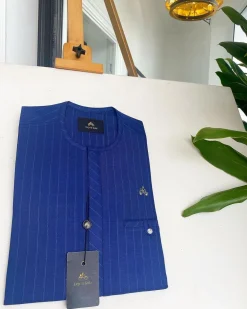 An Azure blue with Lapis blue stripe, Swarovski Button, strap shaped inner pocket details African traditional senator kaftan native.