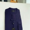 An Eggplant purple, combat front flap and pocket with a black Swarovski button detailing African traditional senator kaftan native.