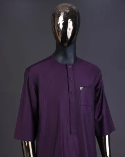 An eggplant purple front flap with matching Swarovski button detailing kaftan and Sokoto