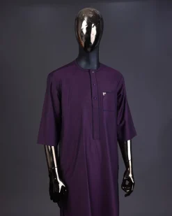 An eggplant purple front flap with matching Swarovski button detailing kaftan and Sokoto