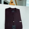 An eggplant purple, mid-section front flap, and piped pocket African traditional kaftan native