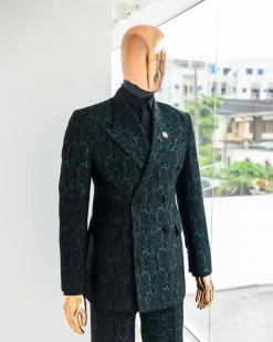 An Emerald green & black “rival” 1/4 cut ocean element peak lapel double breasted jacquard suit.