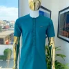 An emerald green embroidery detailing African traditional senator kaftan native