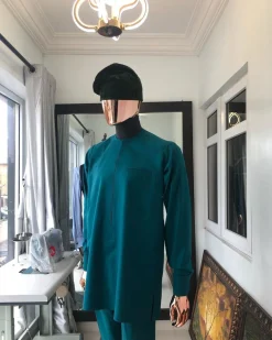 An Emerald Green front flap African senator Kaftan with hand woven velvet Egba Yoruba hat