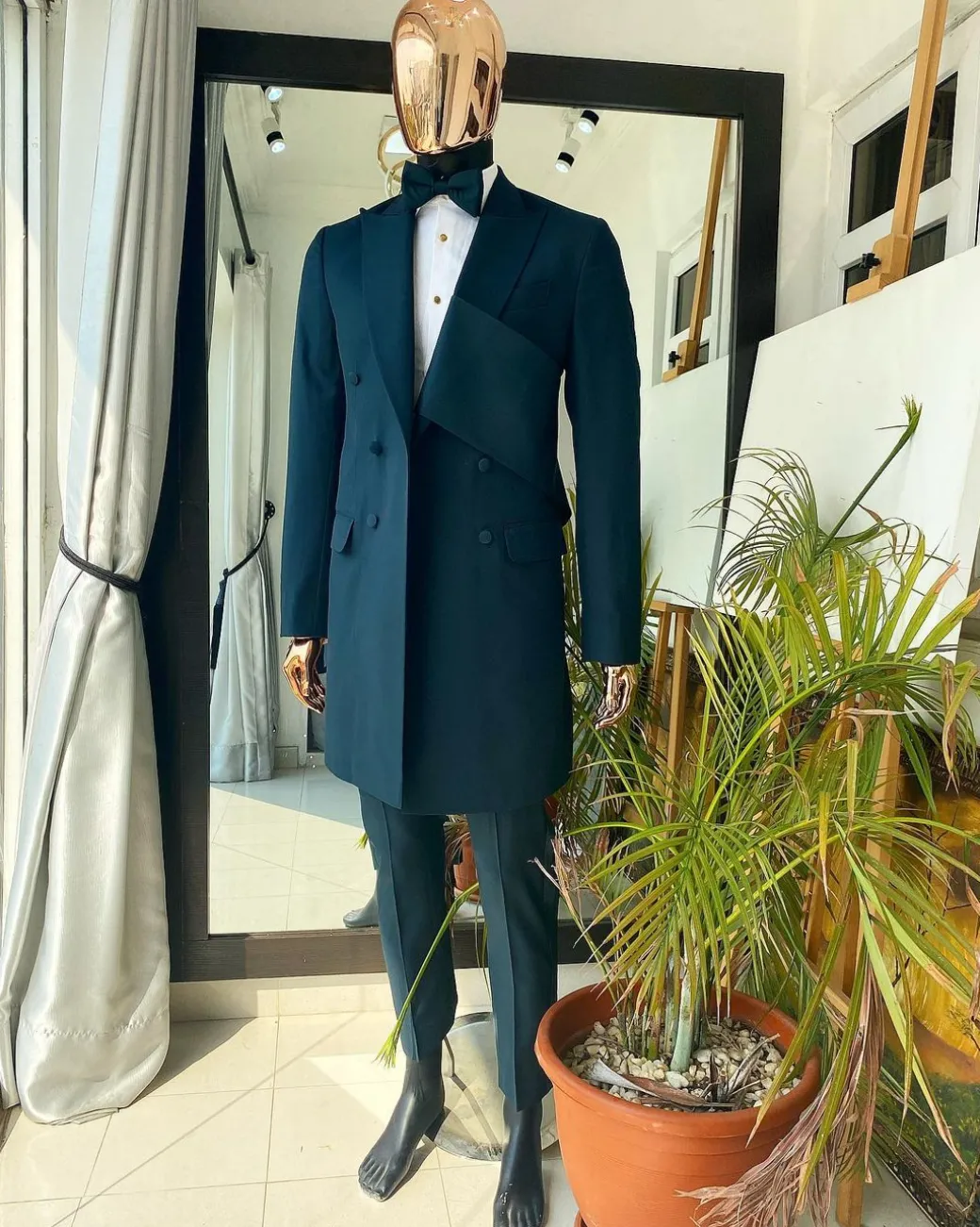 An Emerald green “Oranmiyan” trench blazer suit