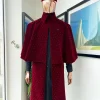 An “Eyes Wide Shut” mahogany red soaked Italian velvet Ceremonial suktan with black Swarovski stone detailing
