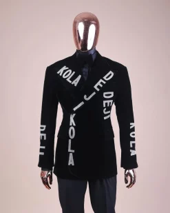 An “inscribe” your name charcoal black soaked velvet peak lapel wrap tuxedo suit