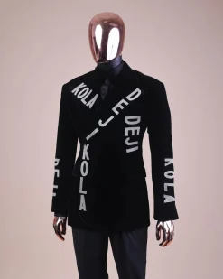 An “inscribe” your name charcoal black soaked velvet peak lapel wrap tuxedo suit