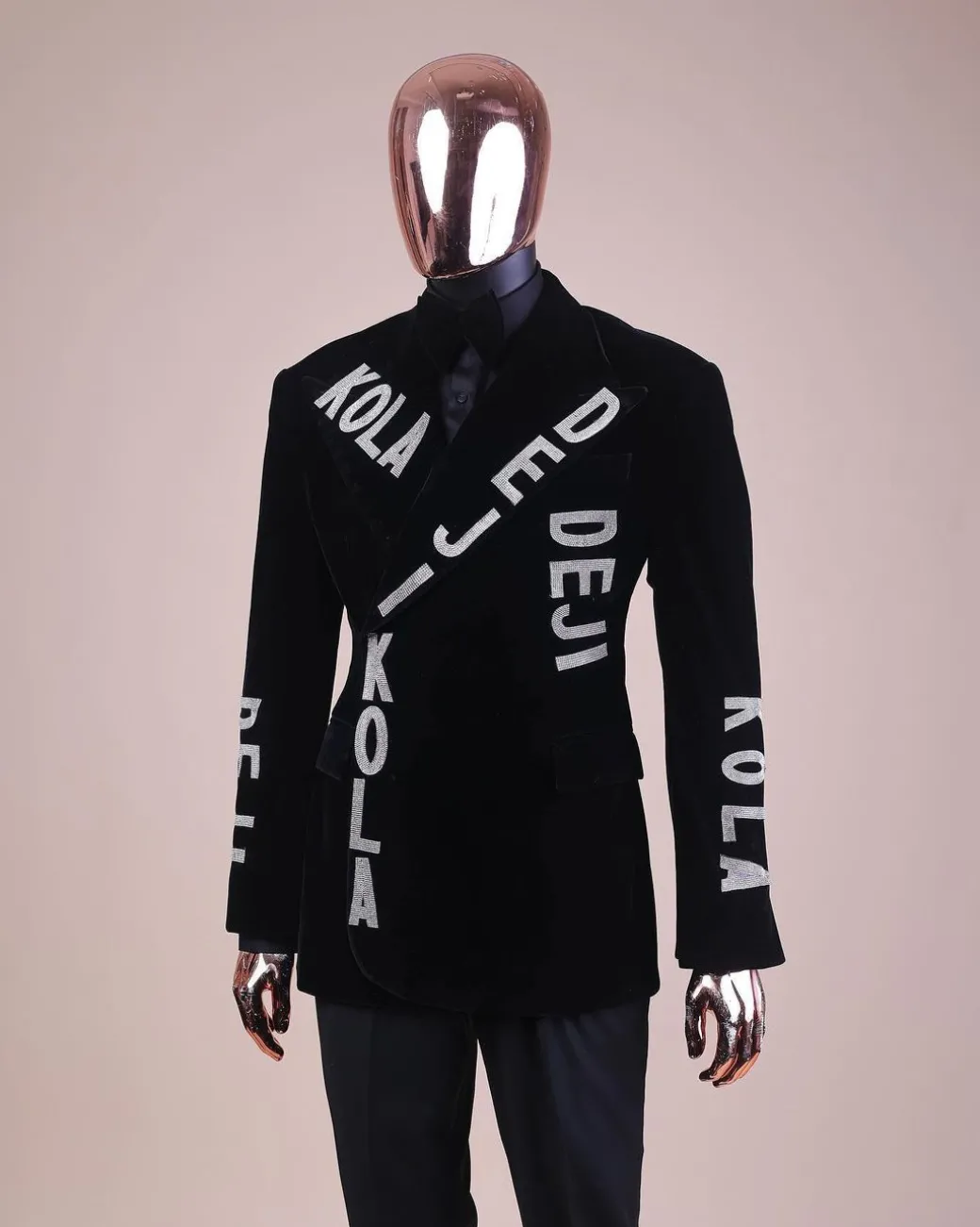 An “inscribe” your name charcoal black soaked velvet peak lapel wrap tuxedo suit
