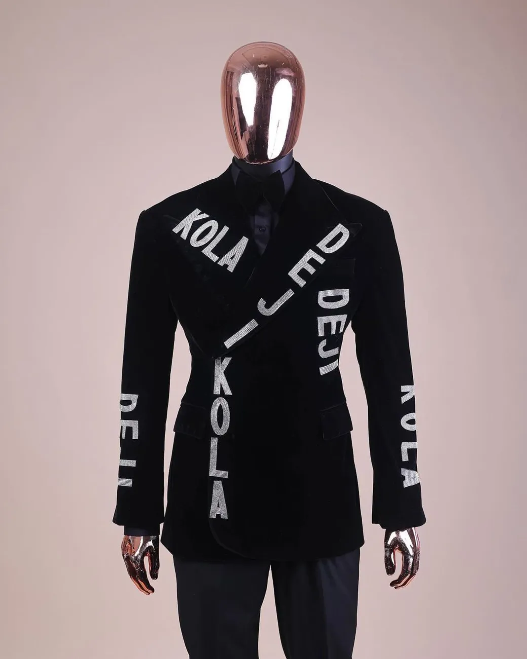 An “inscribe” your name charcoal black soaked velvet peak lapel wrap tuxedo suit