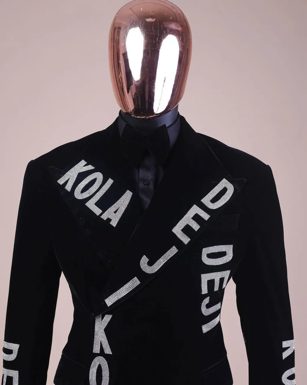 An “inscribe” your name charcoal black soaked velvet peak lapel wrap tuxedo suit