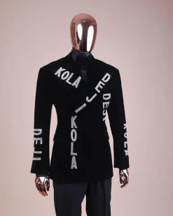 An “inscribe” your name charcoal black soaked velvet peak lapel wrap tuxedo suit