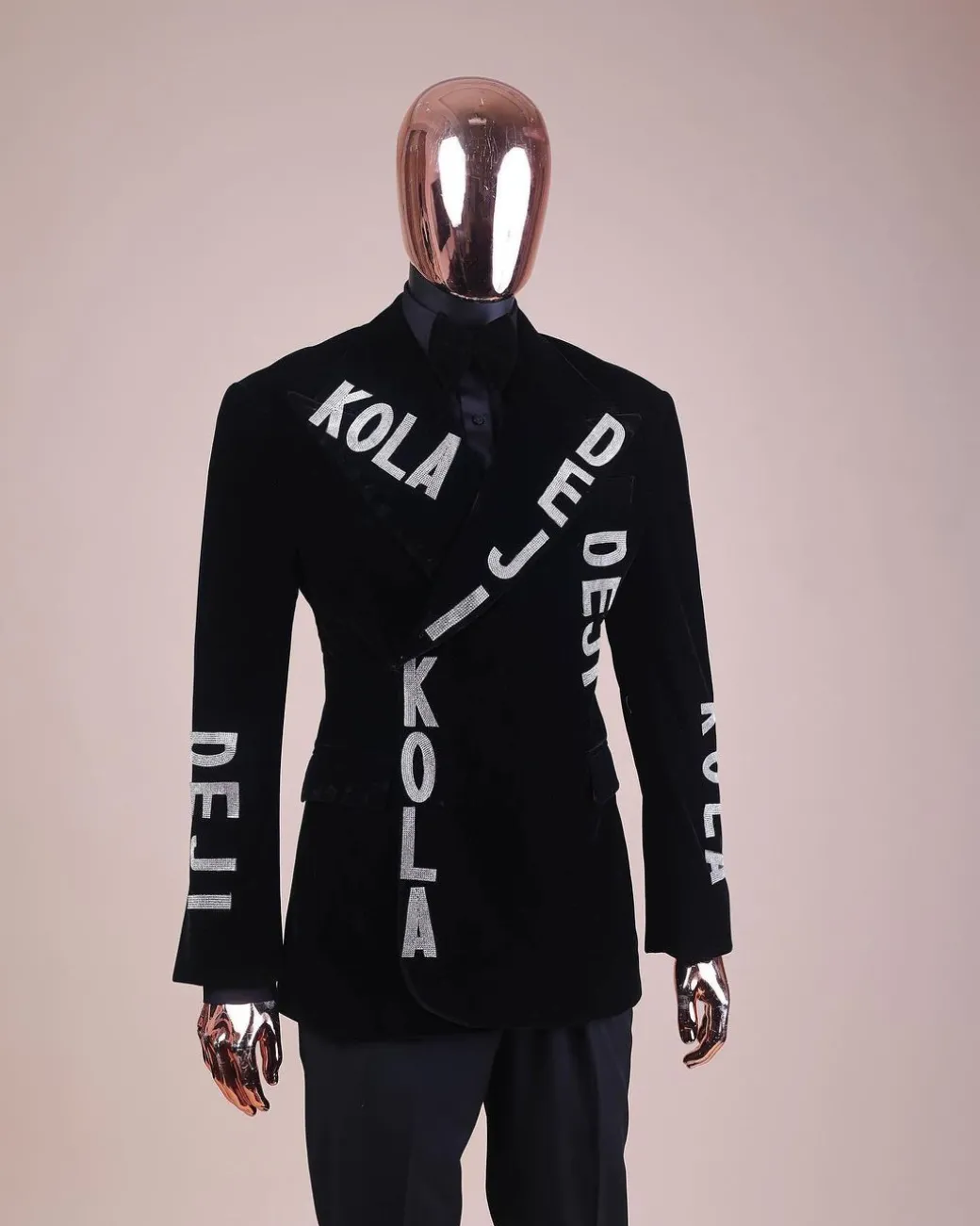 An “inscribe” your name charcoal black soaked velvet peak lapel wrap tuxedo suit