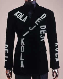 An “inscribe” your name charcoal black soaked velvet peak lapel wrap tuxedo suit