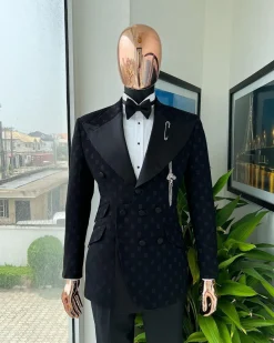 An Inverted “Pirate”, knitted, charcoal black with distributed square pattern jacquard peak lapel, 9 button tuxedo suit.