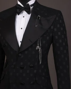 An Inverted “Pirate”, knitted, charcoal black with distributed square pattern jacquard peak lapel, 9 button tuxedo suit.