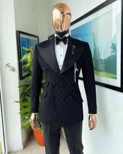 An Inverted “Pirate”, knitted, charcoal black with distributed square pattern jacquard peak lapel, 9 button tuxedo suit.
