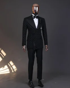 An Inverted “Pirate”, knitted, charcoal black with distributed square pattern jacquard peak lapel, 9 button tuxedo suit.