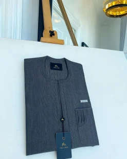 An invisible windowpane grey check, single pocket, front flap African traditional senator kaftan native.